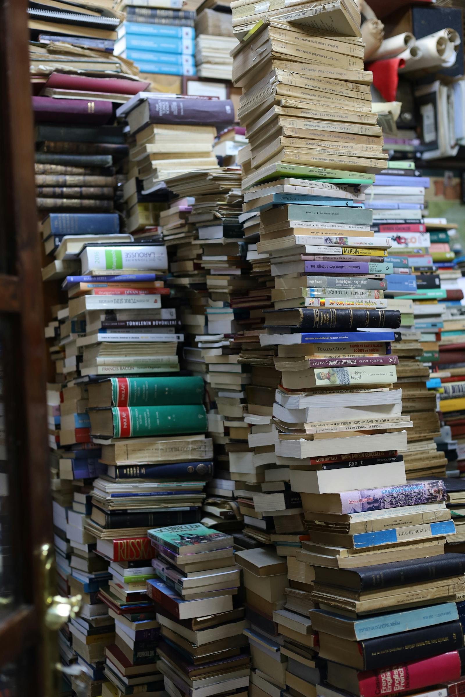 Towering stacks of books inside an independent bookshop